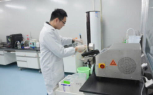 Technician working at a laboratory instrument